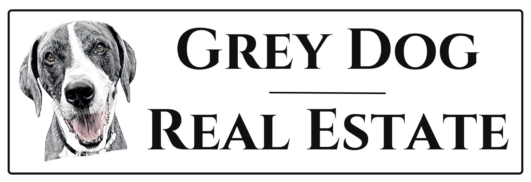 A black and white logo for grey fox real estate.